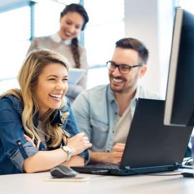 Group of business people and software developers working as a te