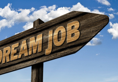 Cream job sign A wooden road sign on the shape of an arrow with Dream Job written on it